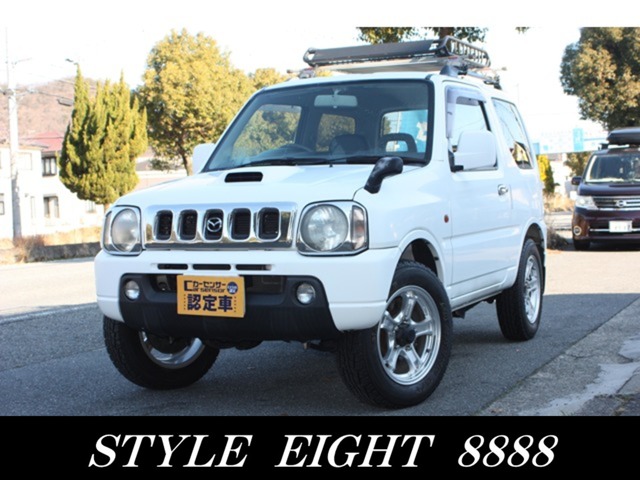 Mazda AZ-Offroad 660 XC 4WD with aftermarket all-weather roof rack and seat covers